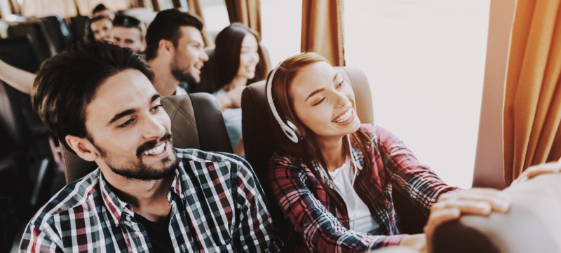 passenger on a bus with headsets